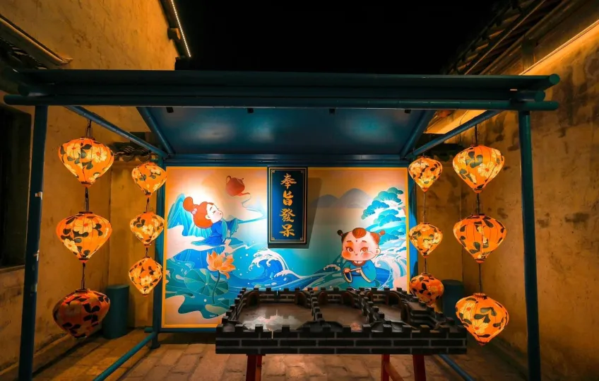 国潮灯会阿福主题灯箱与橙灯笼夜市