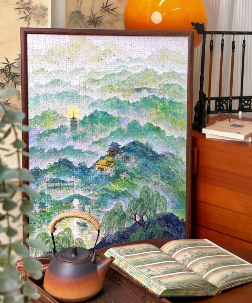 框裝江南風景拼圖茶壺書旁